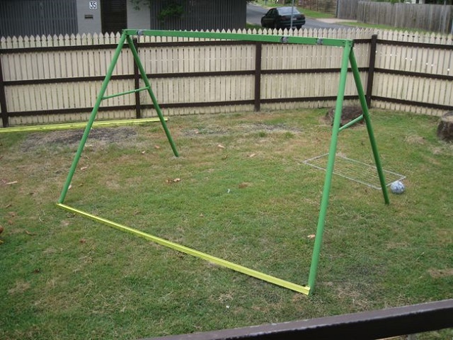 An Old Swing Set Frame Turned Into A DIY Chicken Coop...