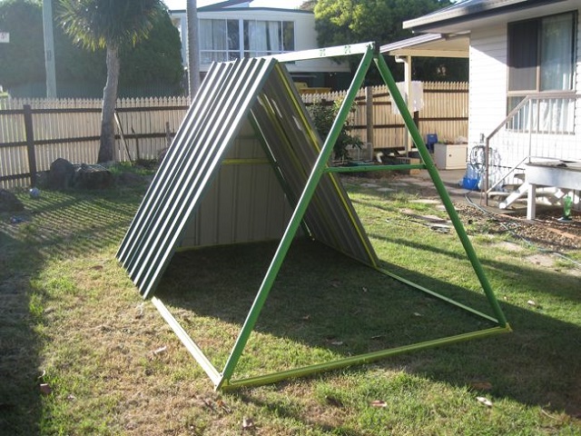 An Old Swing Set Frame Turned Into A DIY Chicken Coop...