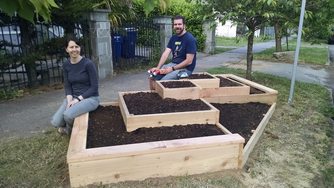 Couple Build A Raised Garden On Their Front Lawn To Grow Food For Themselves & Their Neighbors...